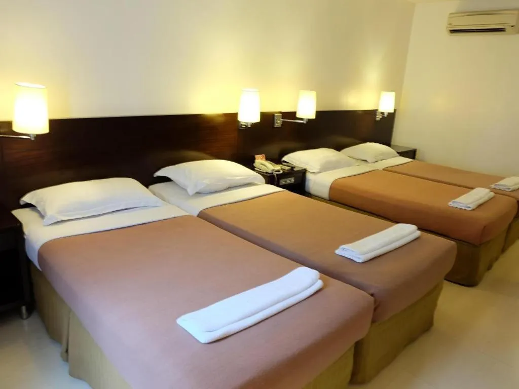 Bed in Hotel Supreme Convention Plaza