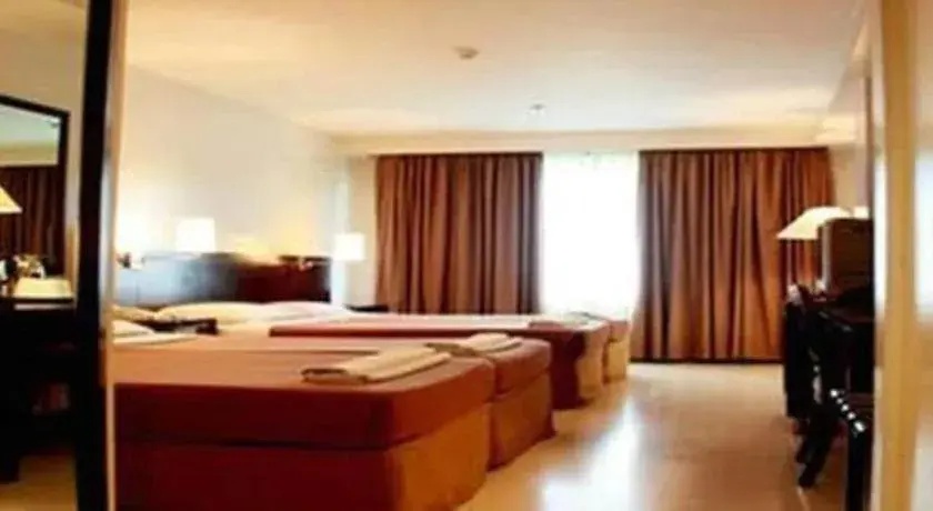 Bed in Hotel Supreme Convention Plaza Bed in Hotel Supreme Convention Plaza