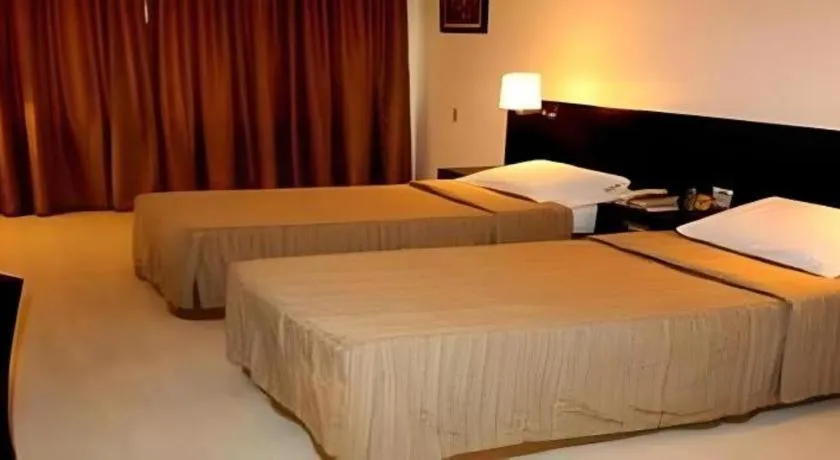 Bed in Hotel Supreme Convention Plaza