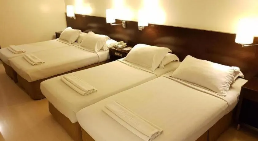 Bed in Hotel Supreme Convention Plaza