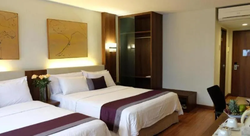 Bed in Grand Cemara Hotel