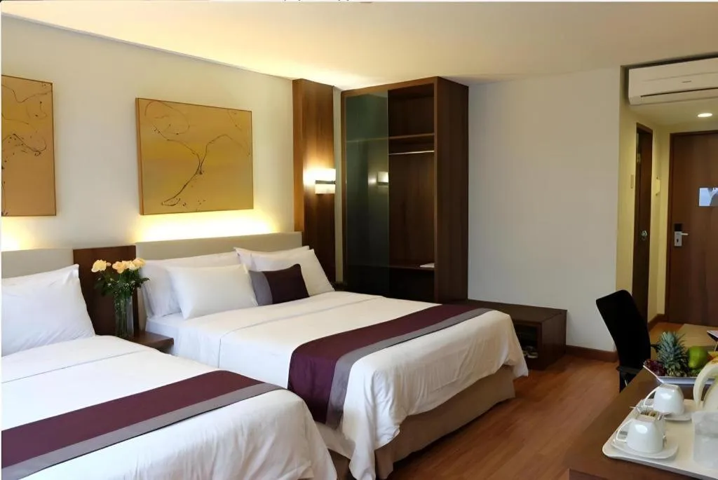 Bed in Grand Cemara Hotel