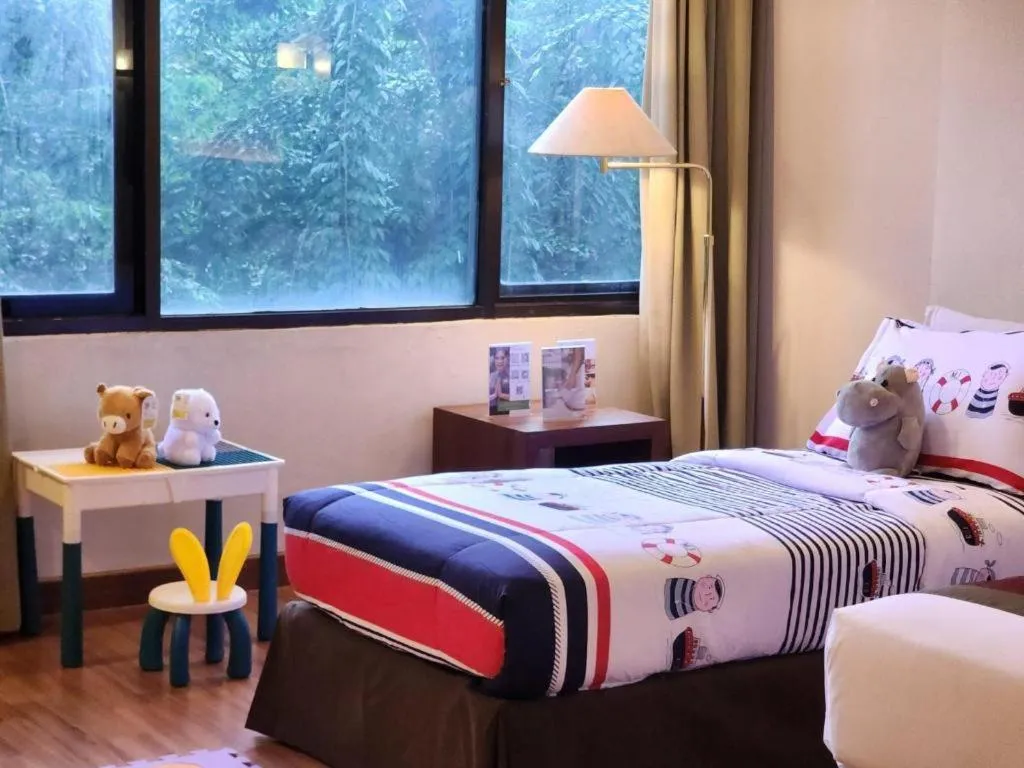 Bed in Grand Cemara Hotel