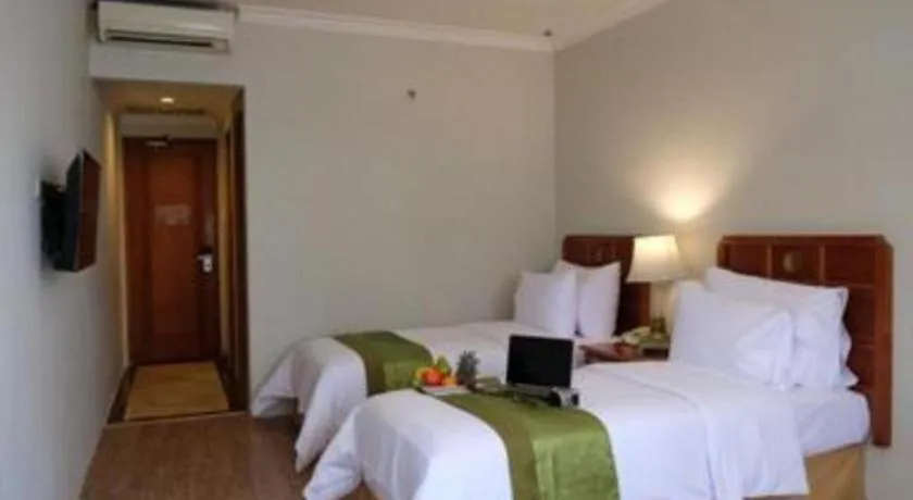 Bed in Grand Cemara Hotel