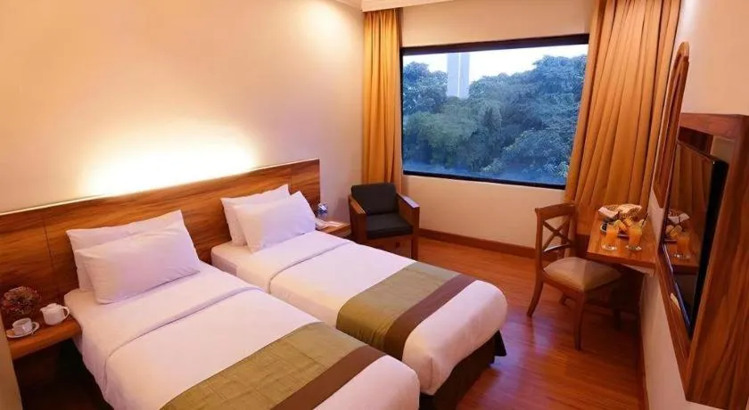 Bed in Grand Cemara Hotel