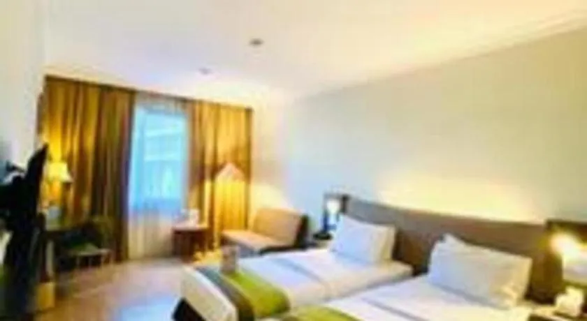 Bed in Grand Cemara Hotel