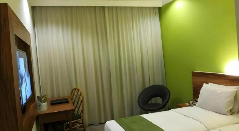 Bed in Grand Cemara Hotel