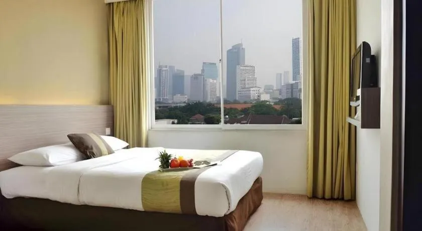 Bed in Grand Cemara Hotel