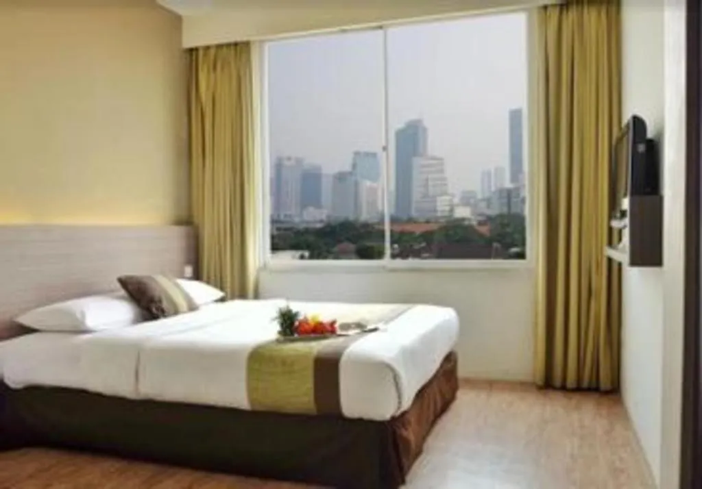 Bed in Grand Cemara Hotel