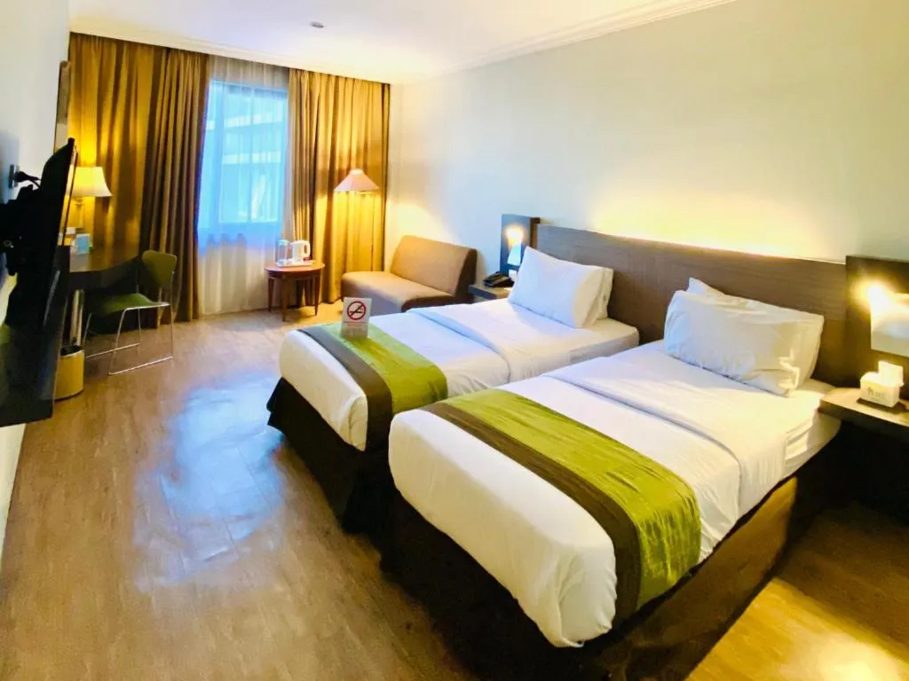 Bed in Grand Cemara Hotel