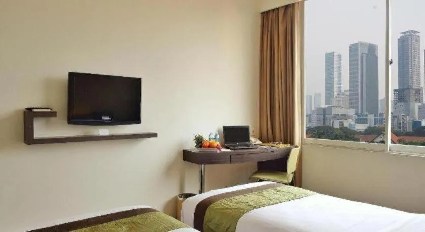 Bed in Grand Cemara Hotel