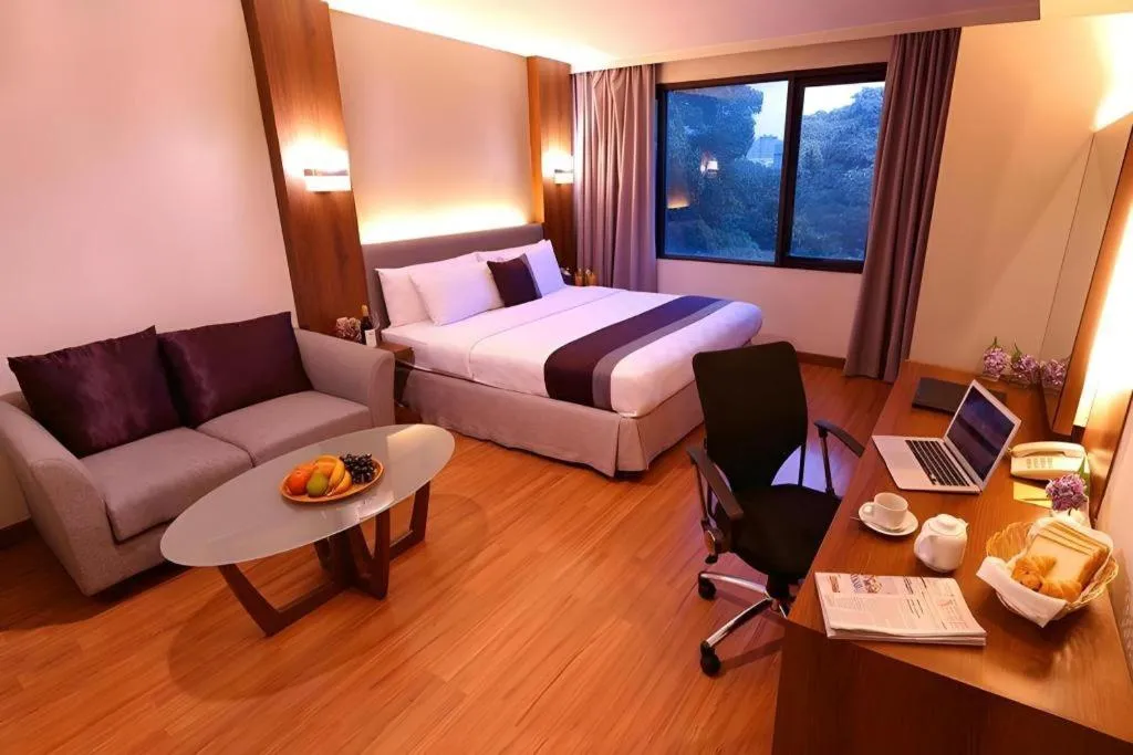 Bed in Grand Cemara Hotel