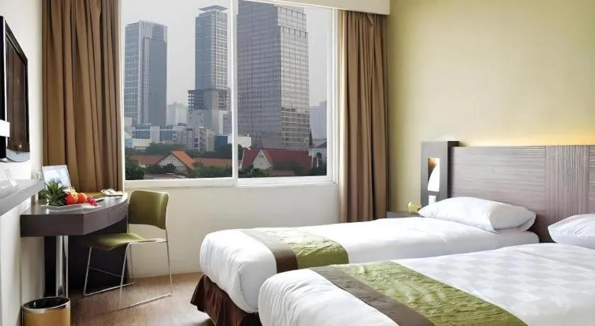 Bed in Grand Cemara Hotel