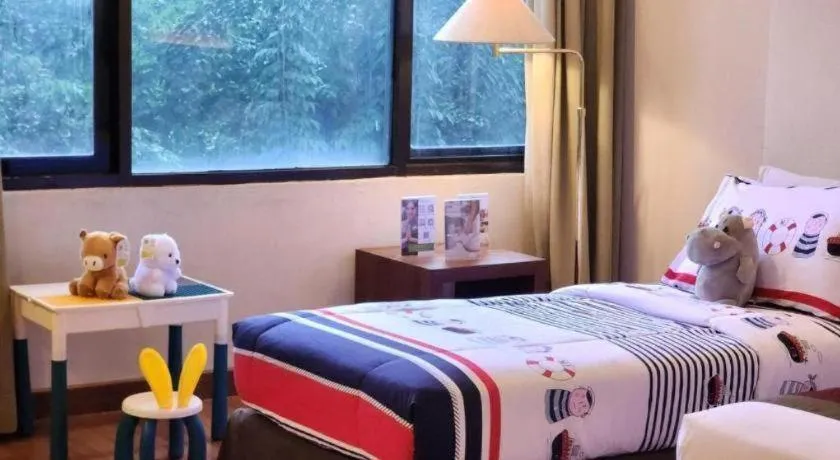 Bed in Grand Cemara Hotel