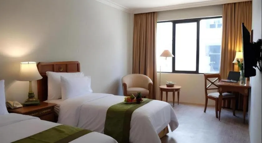 Bed in Grand Cemara Hotel