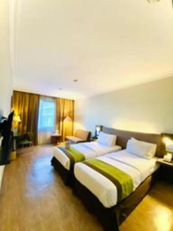 Bed in Grand Cemara Hotel