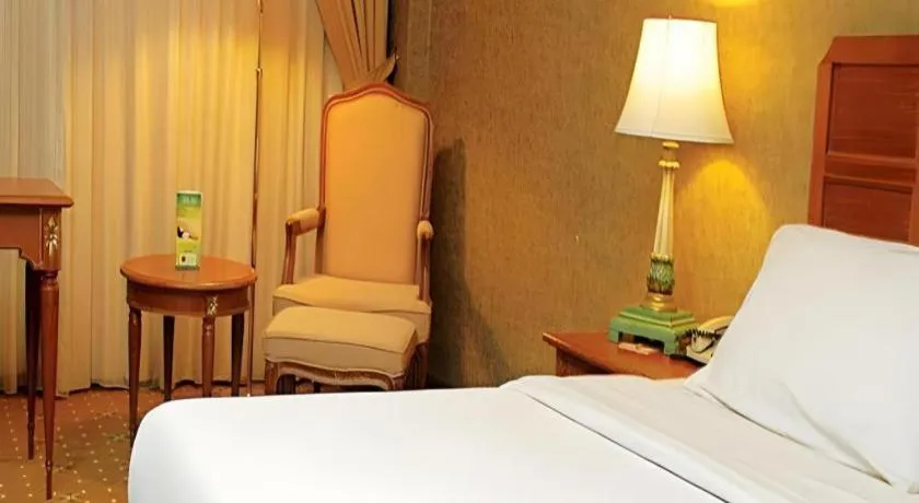 Bed in Grand Cemara Hotel