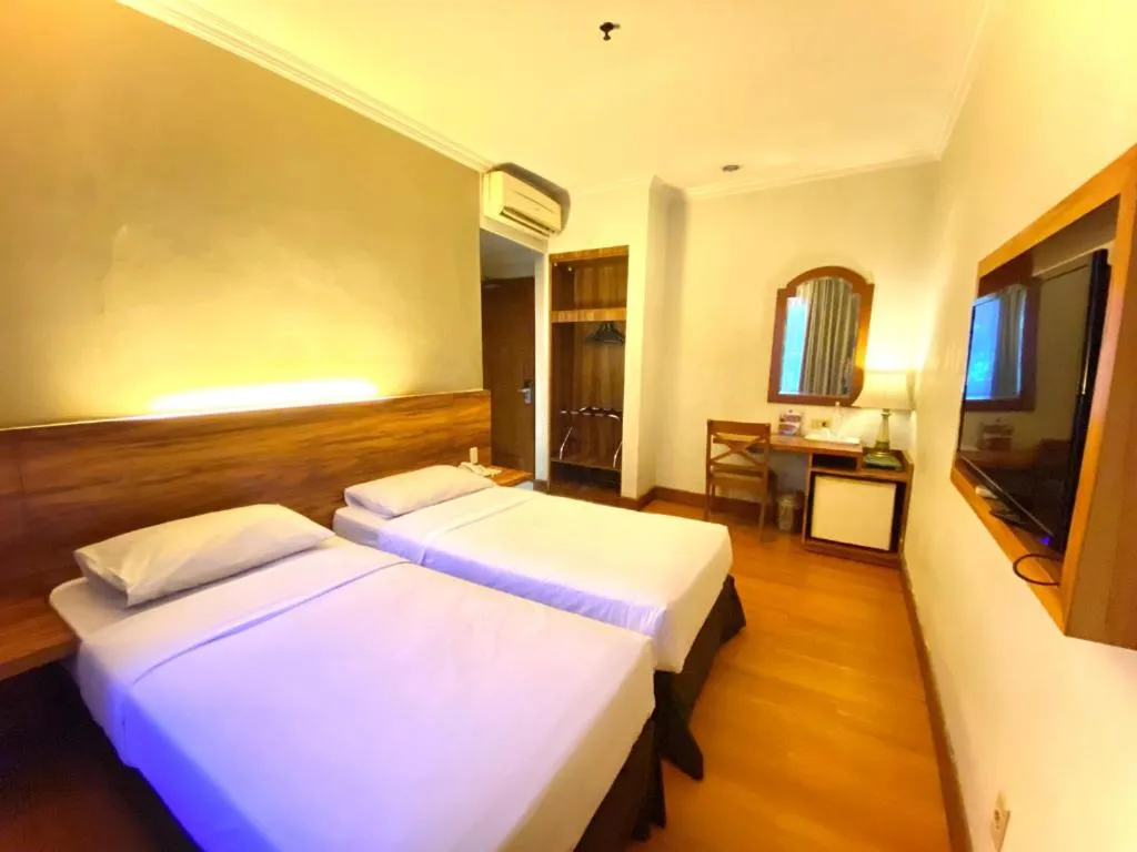 Bed in Grand Cemara Hotel