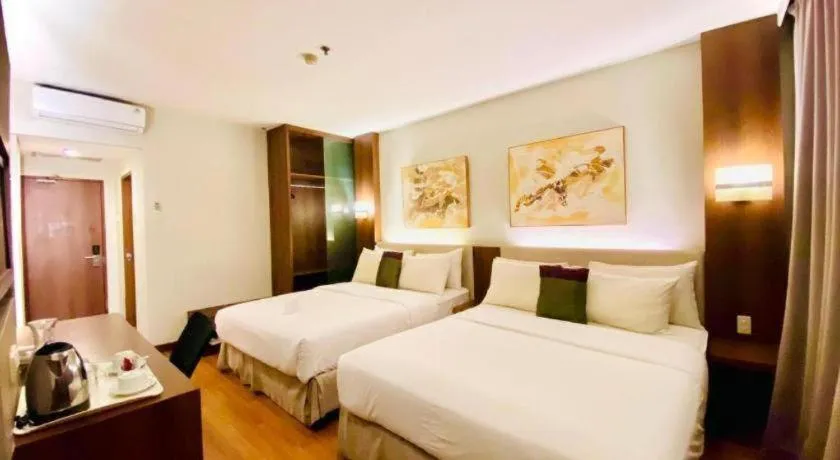 Bed in Grand Cemara Hotel