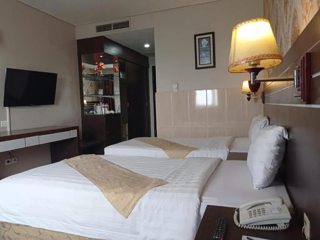Bed in Grand Antares Hotel