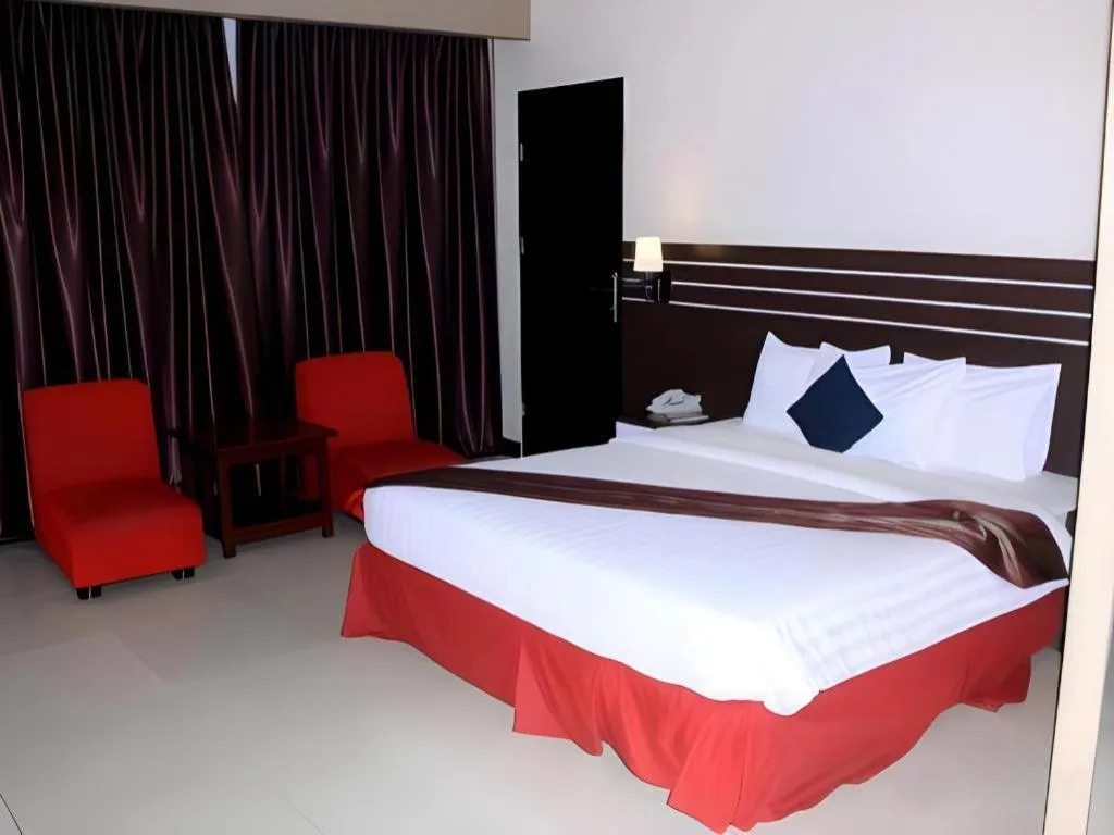 Bed in Grand Antares Hotel