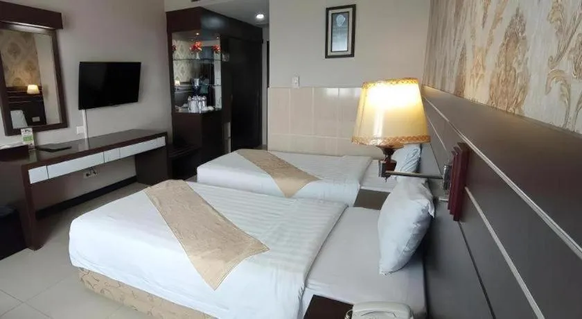 Bed in Grand Antares Hotel
