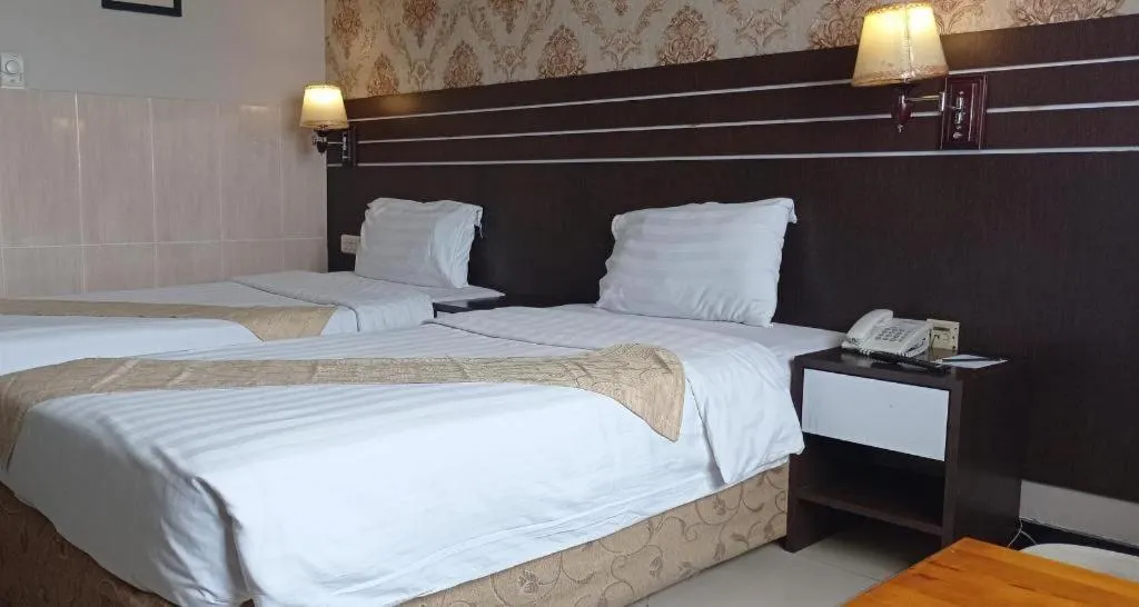 Bed in Grand Antares Hotel