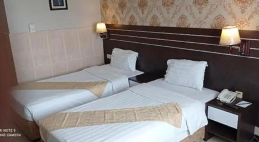 Bed in Grand Antares Hotel