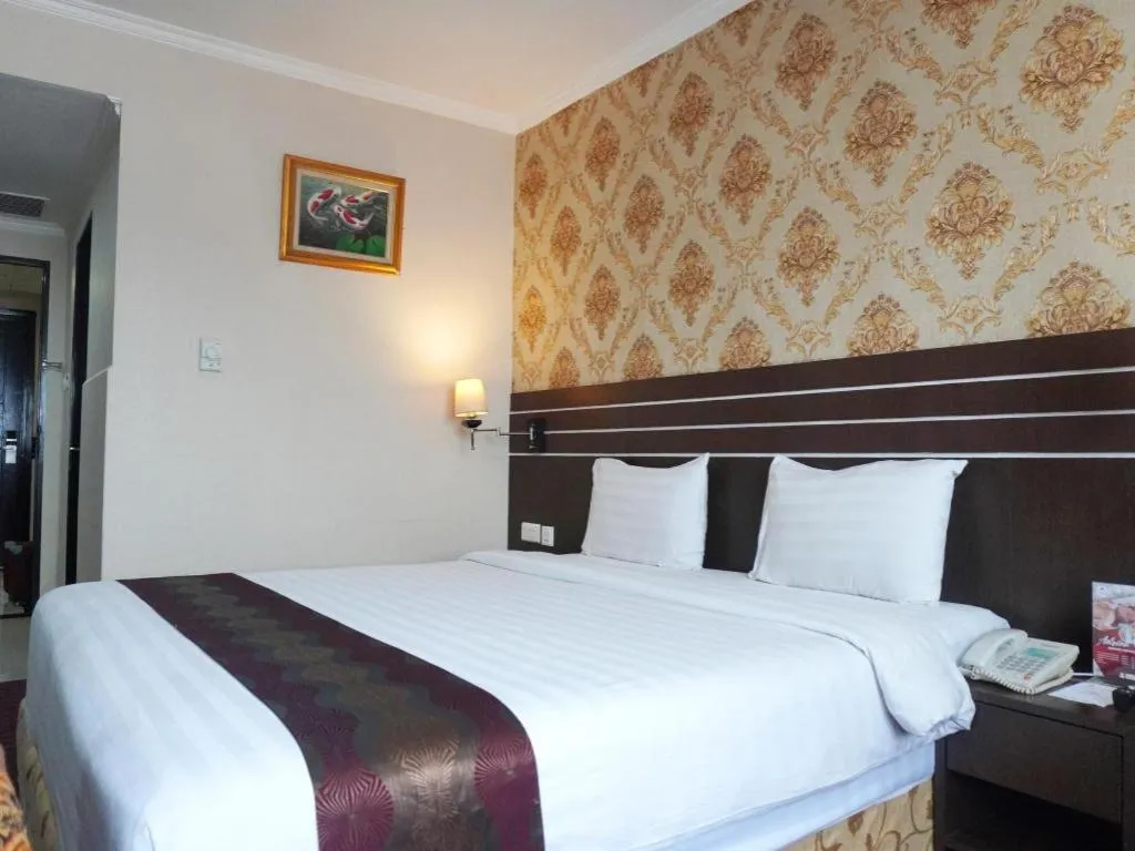 Bed in Grand Antares Hotel