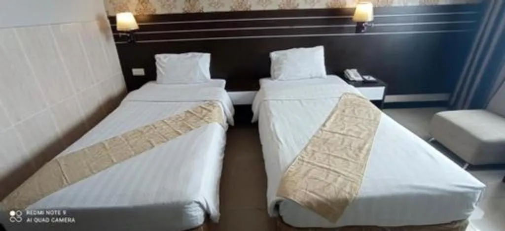 Bed in Grand Antares Hotel