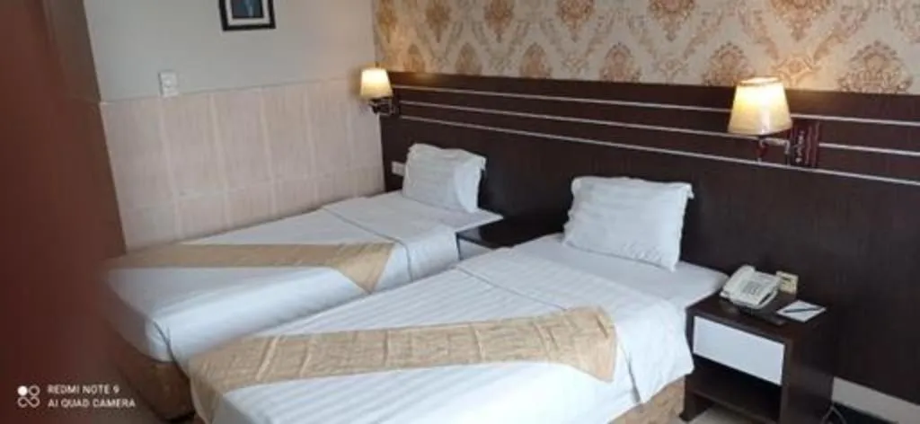 Bed in Grand Antares Hotel