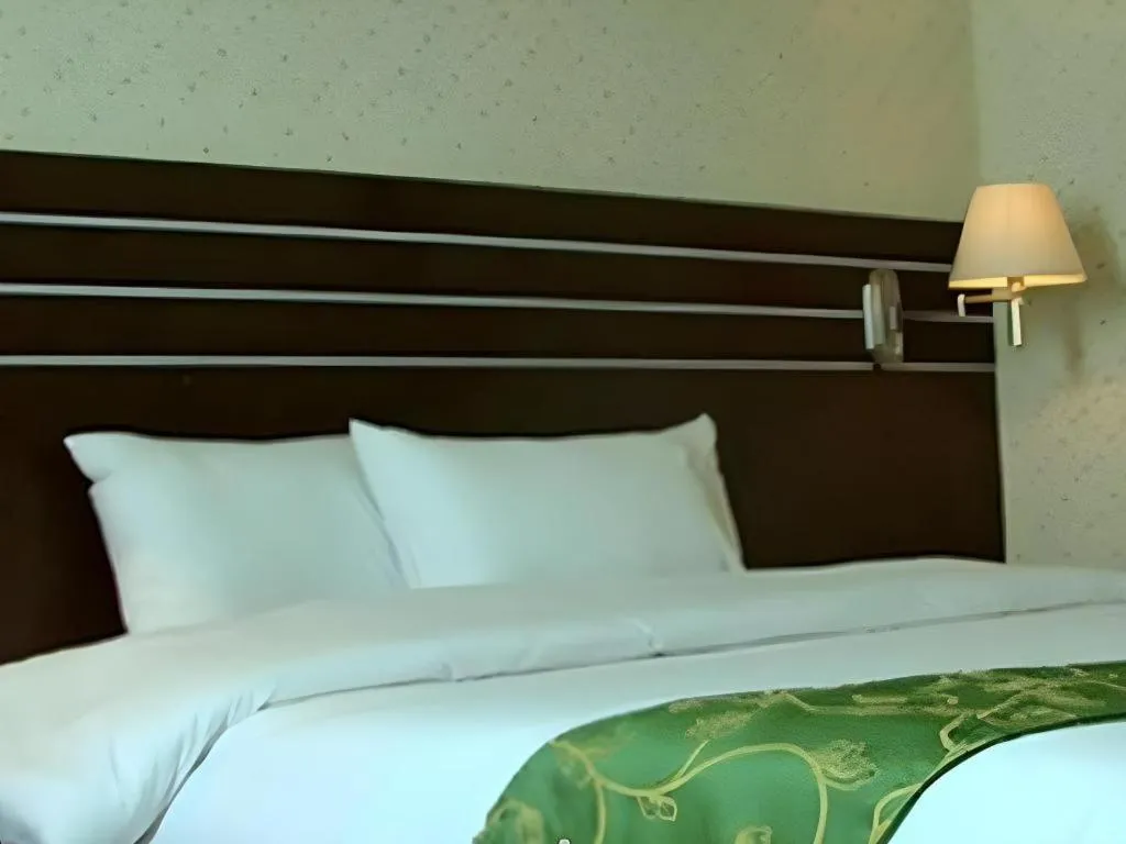 Bed in Grand Antares Hotel