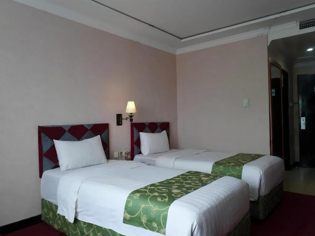 Bed in Grand Antares Hotel