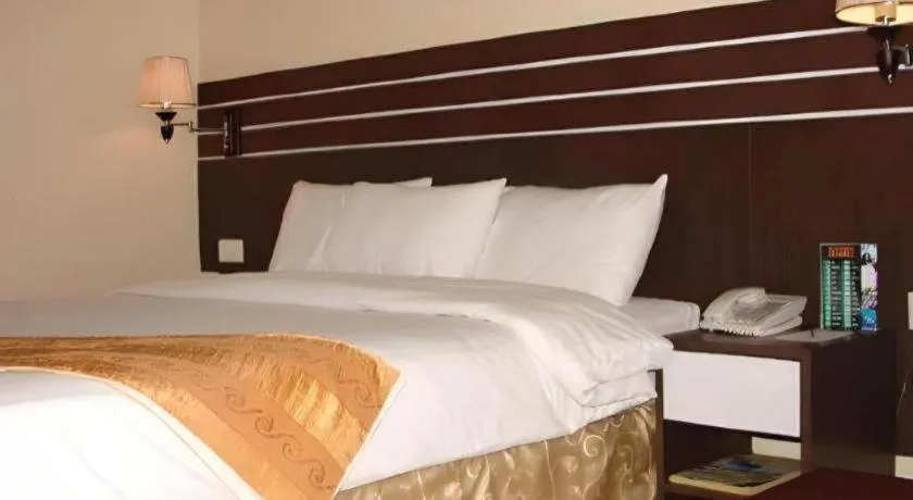 Bed in Grand Antares Hotel