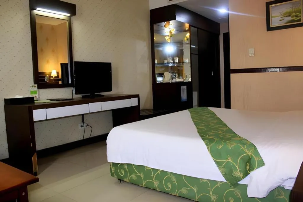 Bed in Grand Antares Hotel