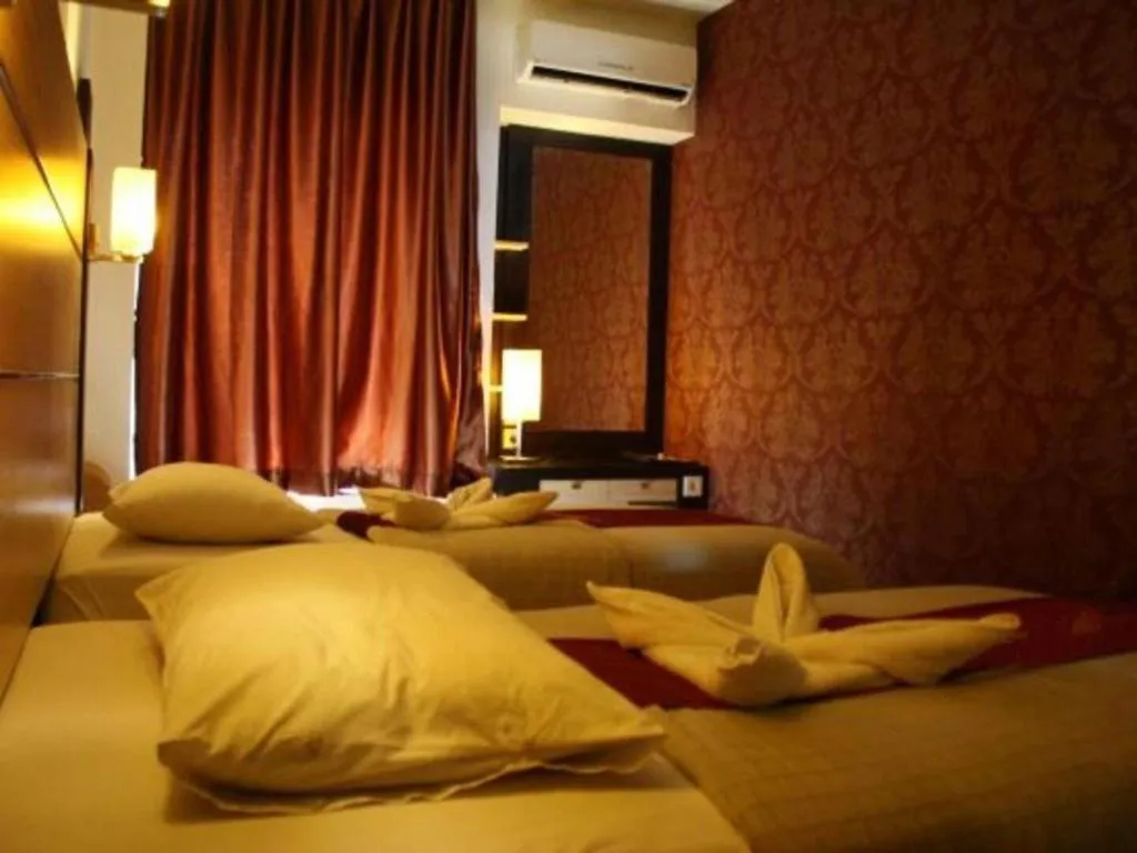 Bed in Travello Hotel Manado