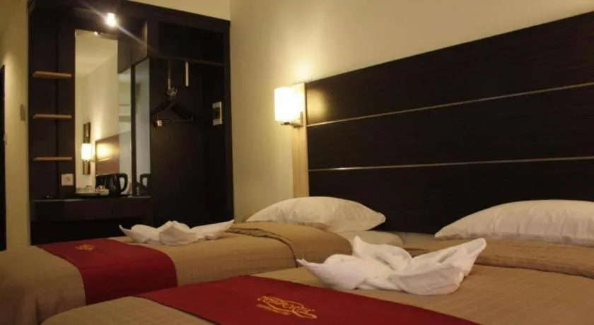 Bed in Travello Hotel Manado