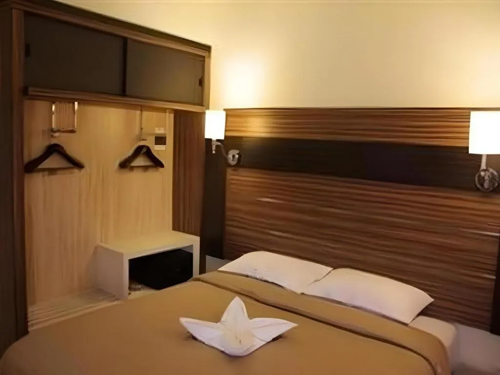 Bed in Travello Hotel Manado