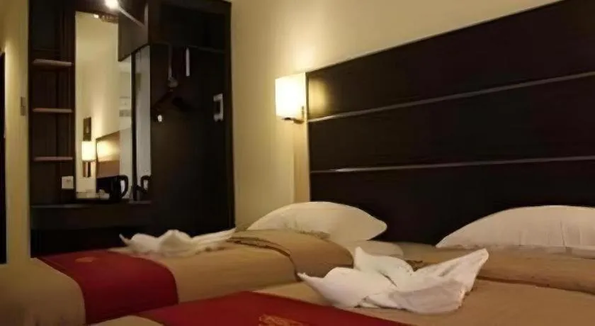 Bed in Travello Hotel Manado