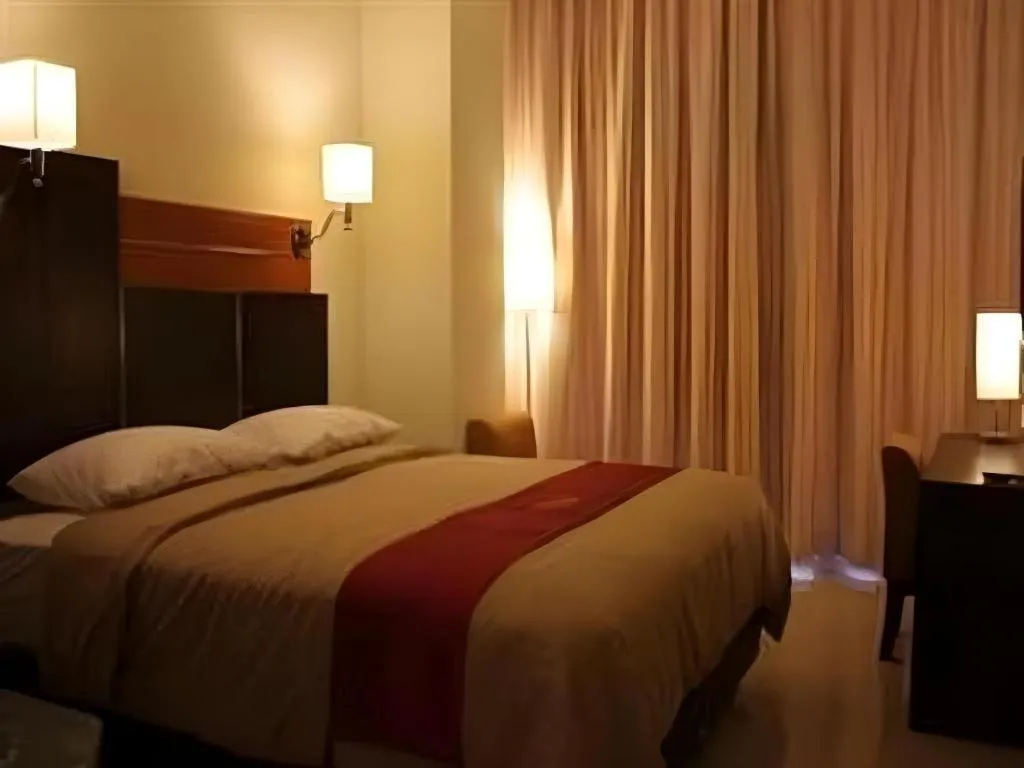 Bed in Travello Hotel Manado