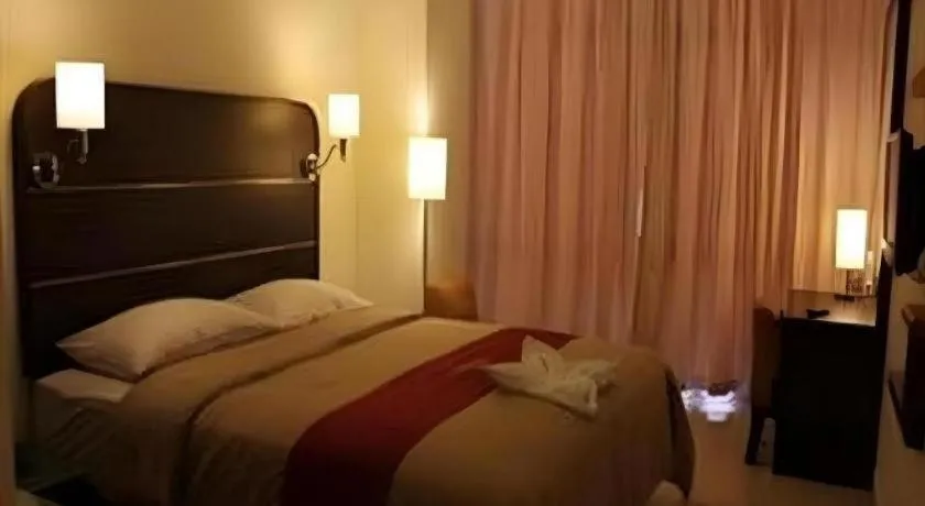 Bed in Travello Hotel Manado