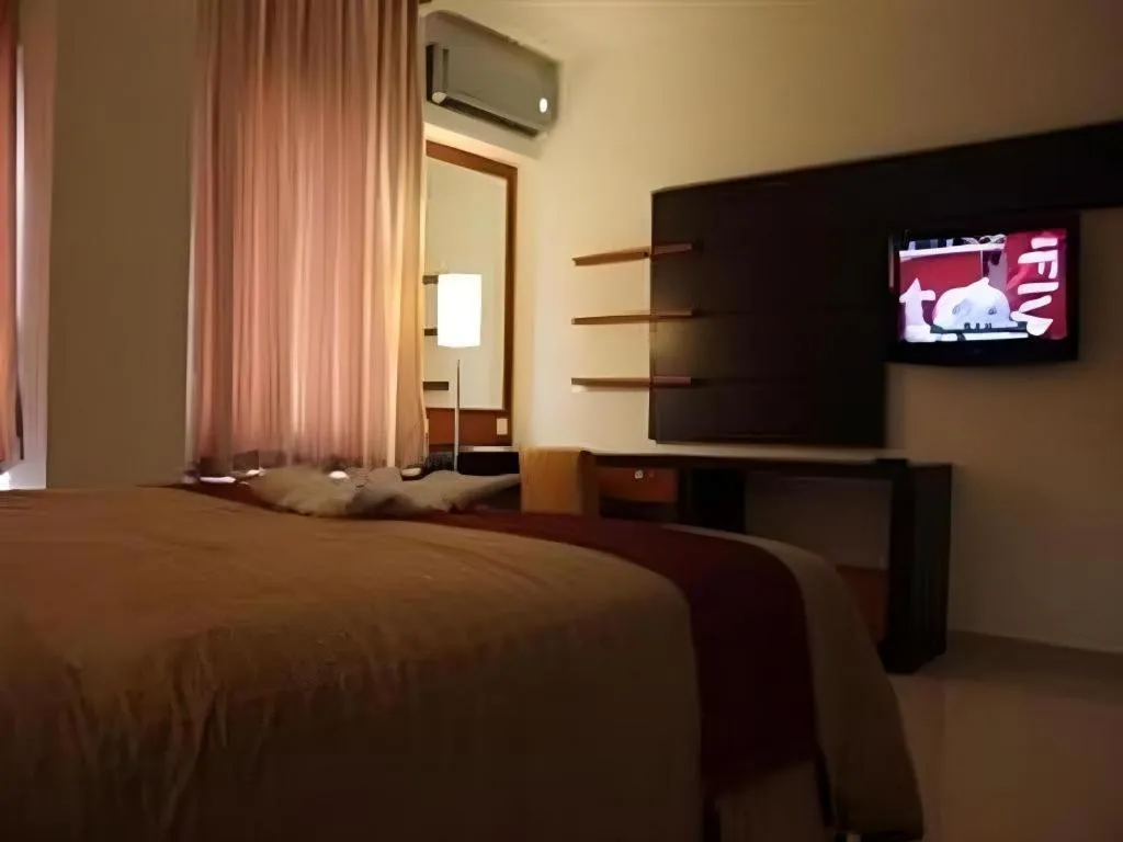 Bed in Travello Hotel Manado