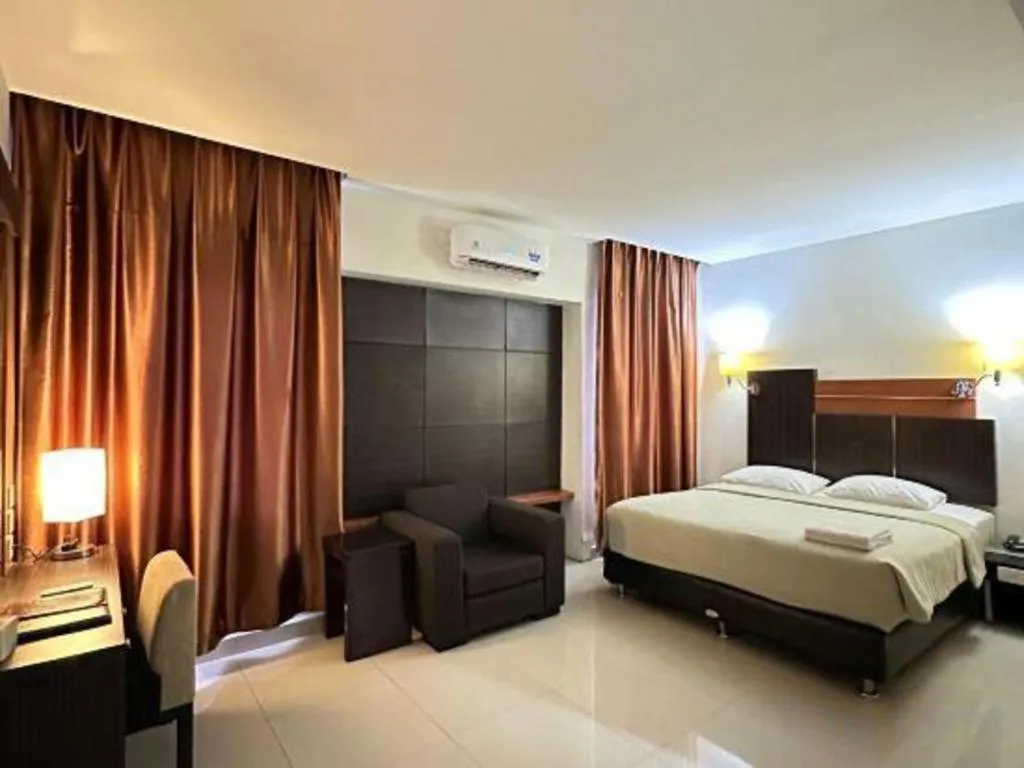 Bed in Travello Hotel Manado