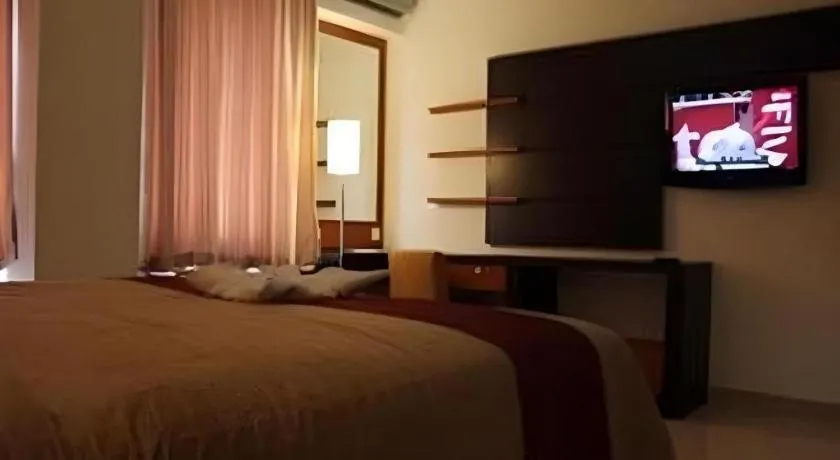 Bed in Travello Hotel Manado