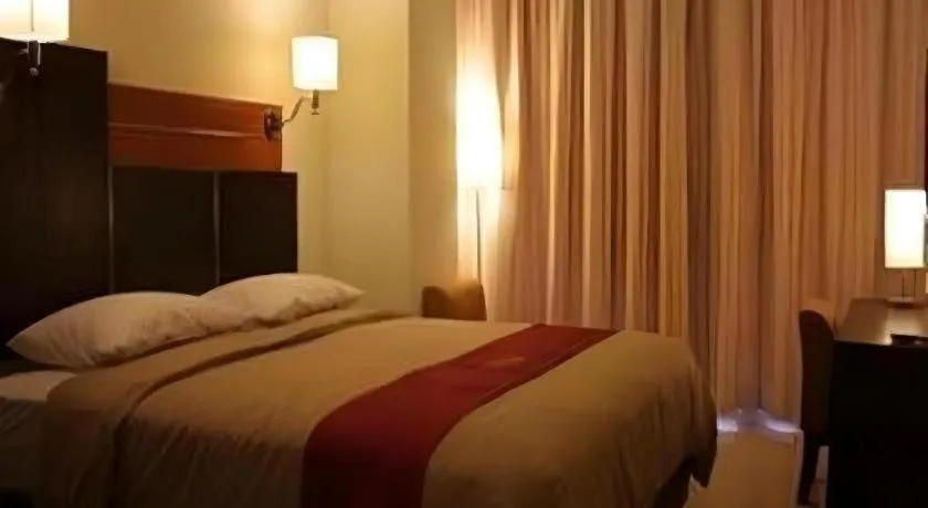 Bed in Travello Hotel Manado
