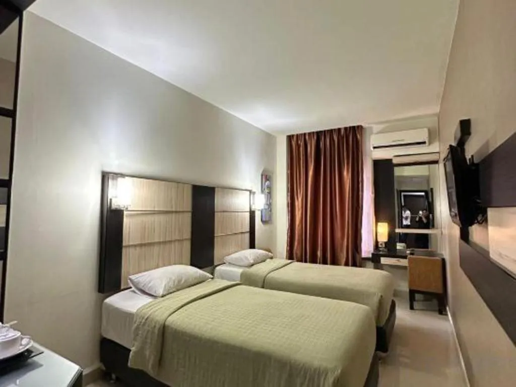 Bed in Travello Hotel Manado