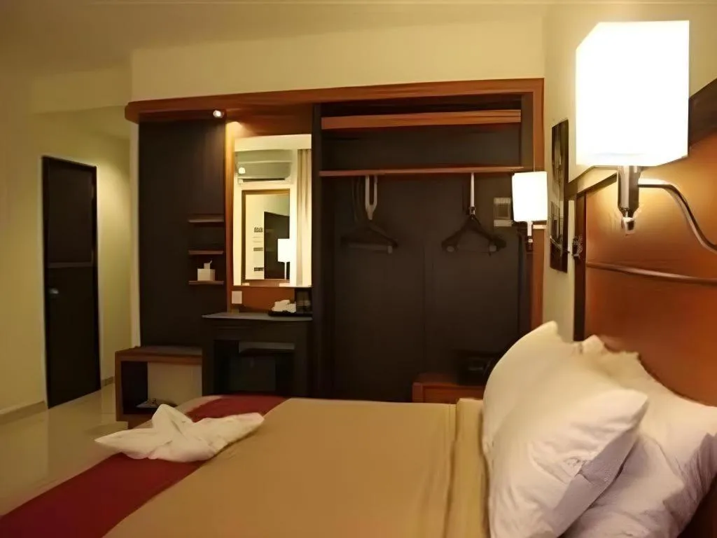 Bed in Travello Hotel Manado