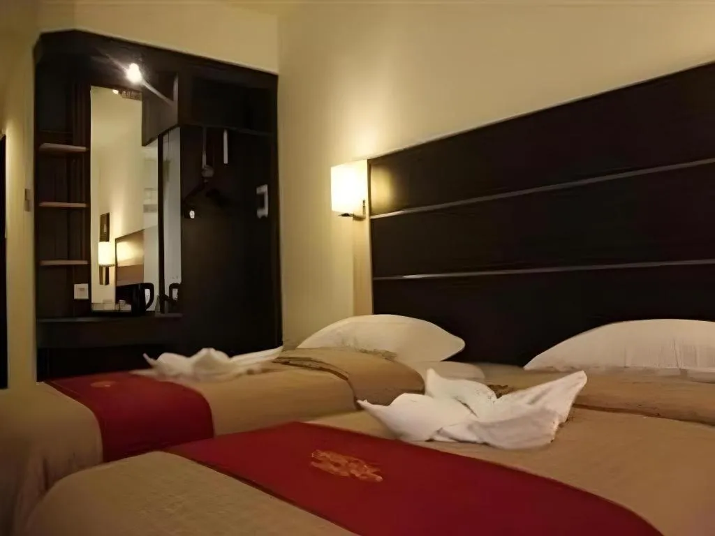 Bed in Travello Hotel Manado