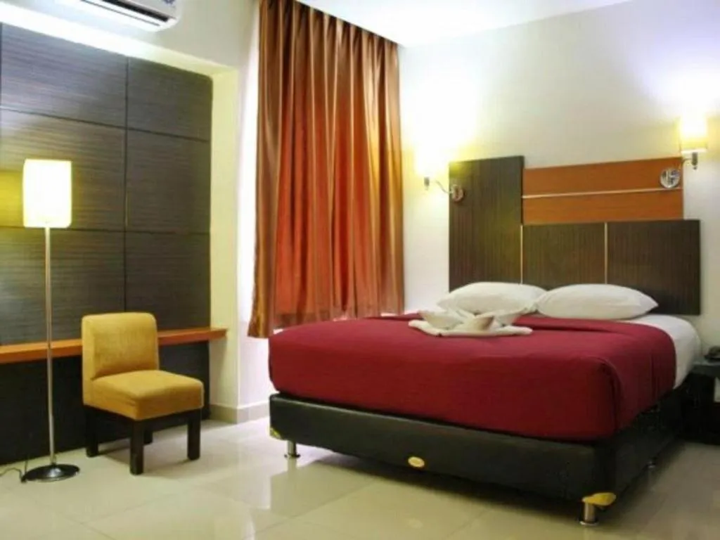 Bed in Travello Hotel Manado
