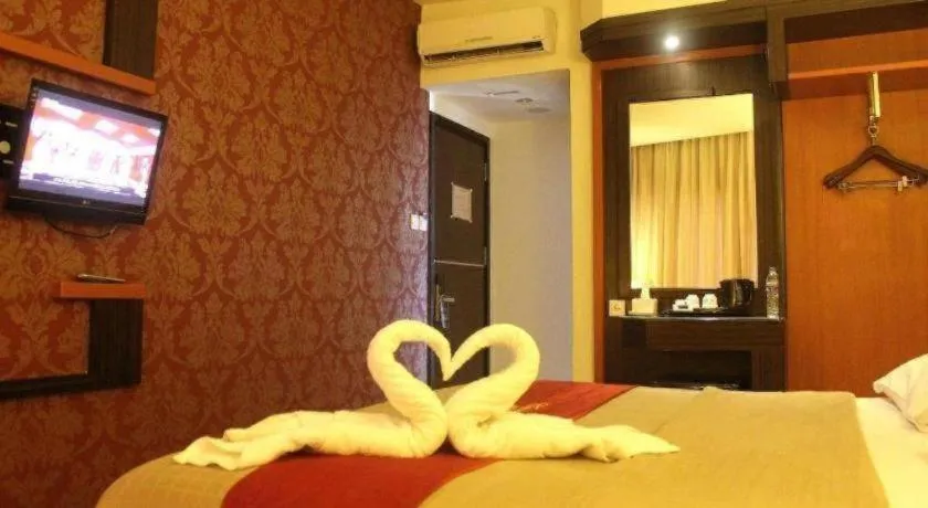 Bed in Travello Hotel Manado